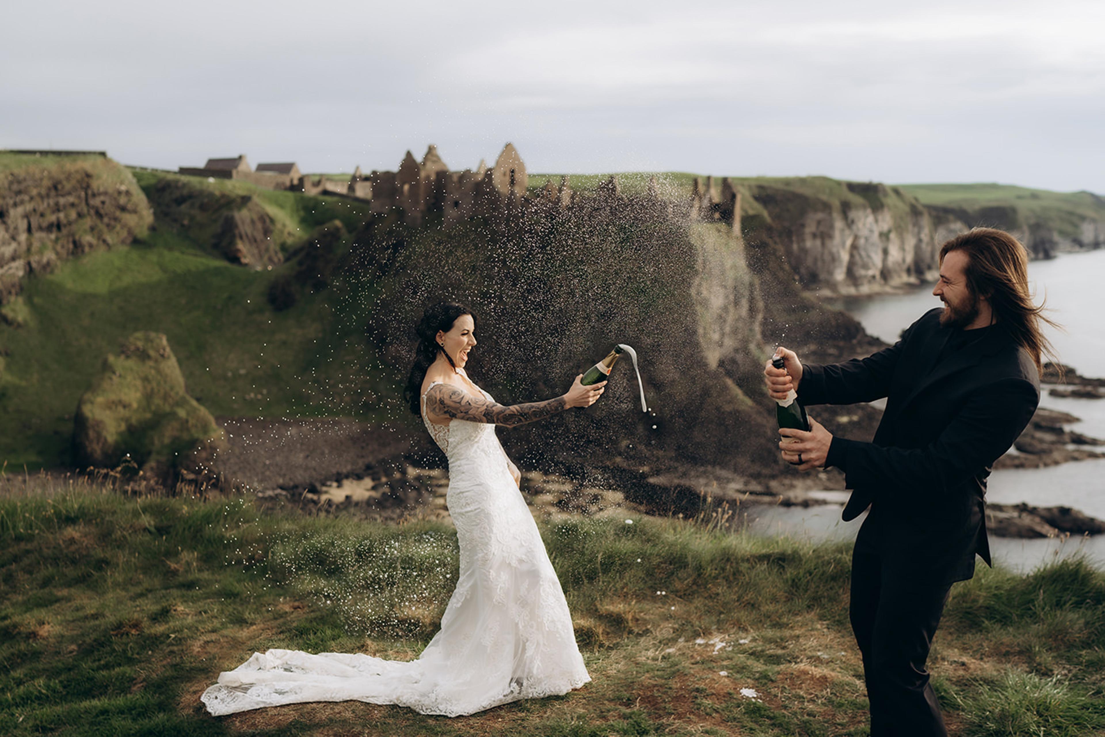 Couple opening champagne