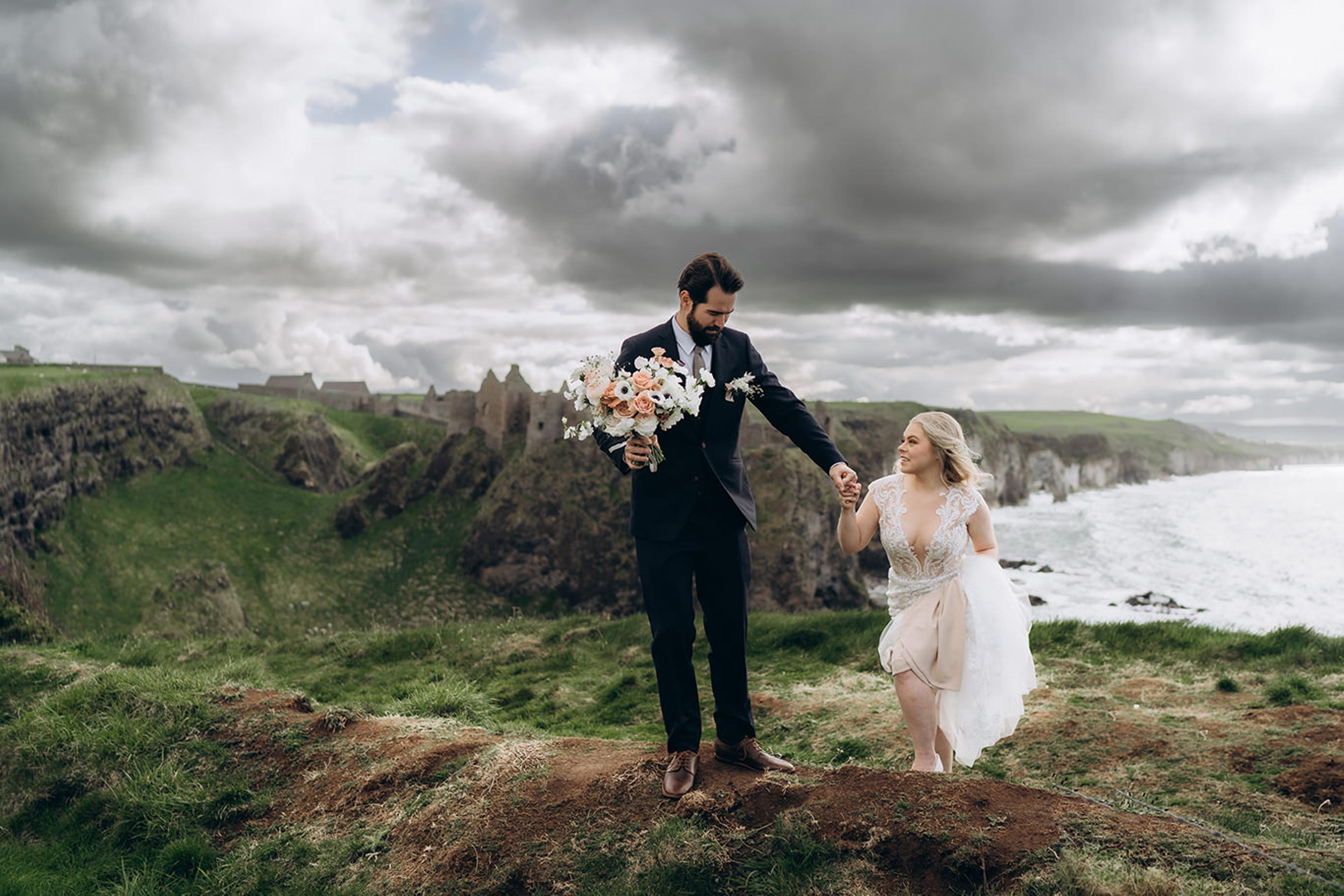 Newlywed couple holding hands